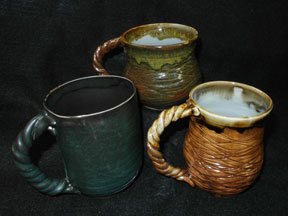 Mugs in various glazes on Helmer's porcelain